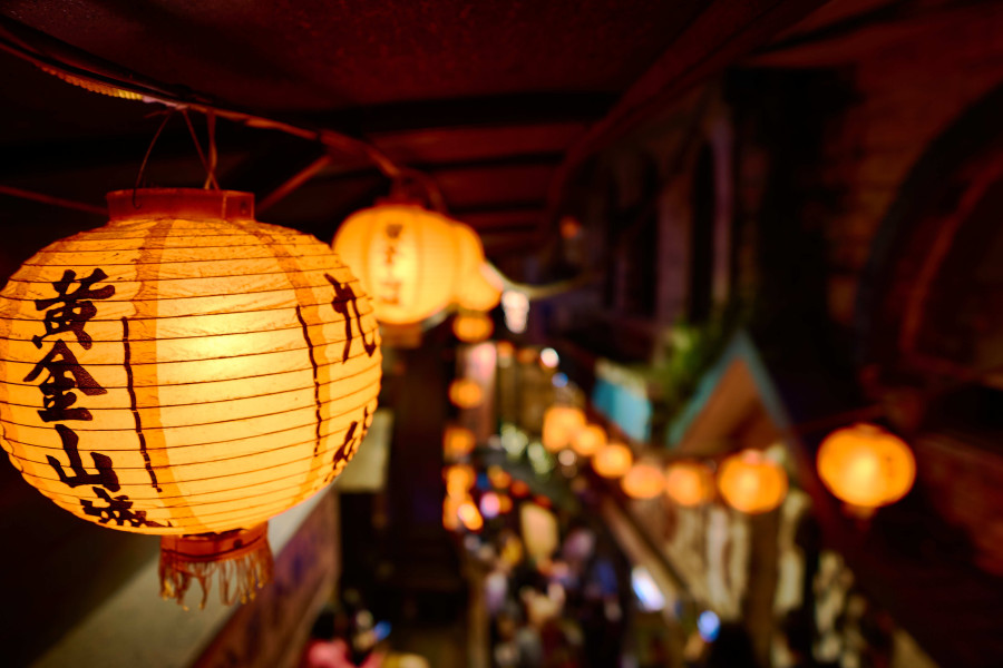 closeup-chinese-paper-lantern-with-lights-surrounded-by-buildings_77d6a.jpg