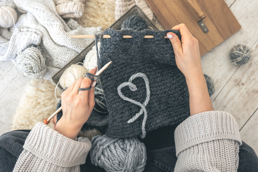 woman-with-gray-threads-knitted-element-sits-floor-top-view_1bb26.jpg